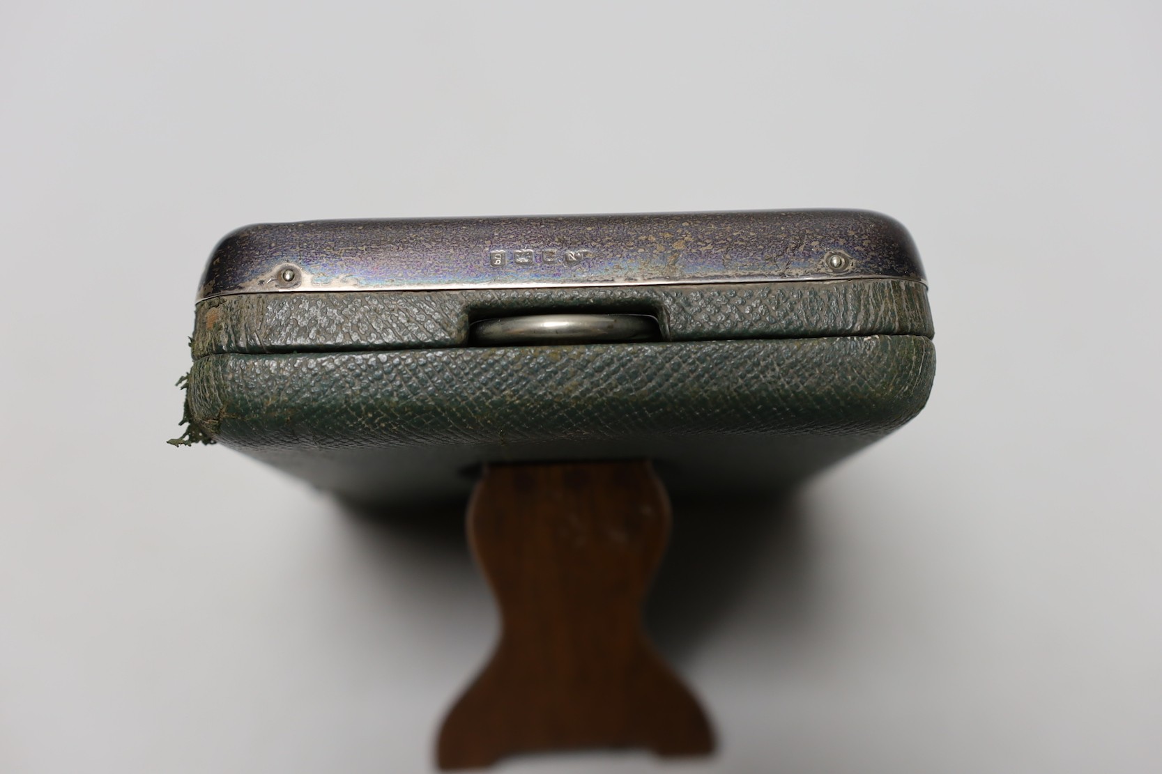 An Edwardian silver mounted travelling watch case, Birmingham, 1906, containing a nickel cased pocket watch, case diameter 66mm.